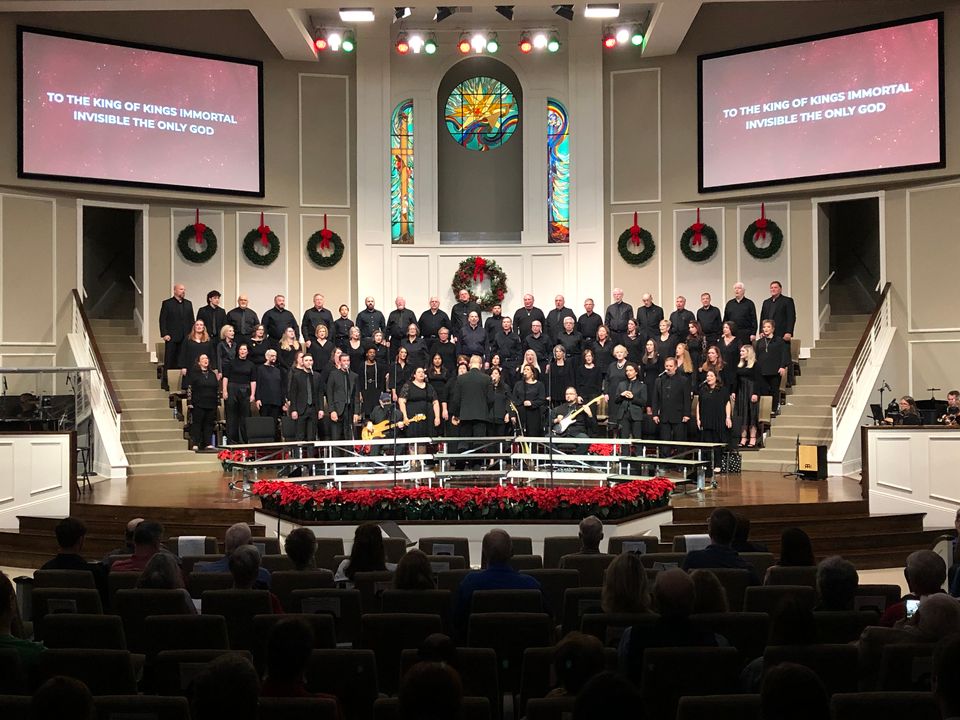 Christmas program at Jefferson Baptist with the choir on the stage under warm lighting